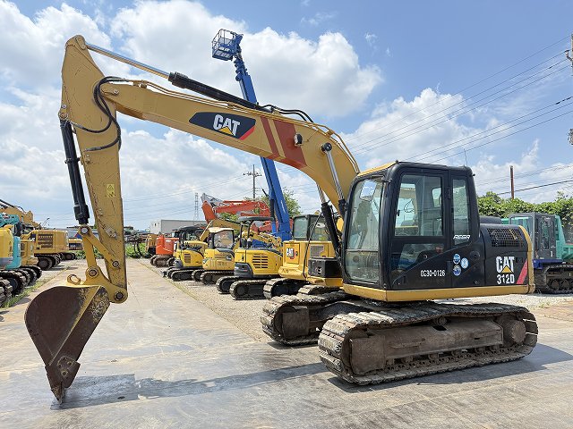 Caterpillar 312D, vista de perfil con cucharón